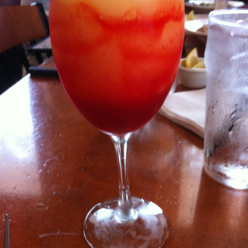 Cheddar's Scratch Kitchen - Peach Bellini with strawberry in it & a cherry on top! - American Near Me - Dallas, Texas