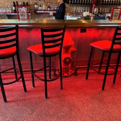 Station 51 Truck Company Bar and Grill - Bar area. Cool old fire hydrants and lighting!
