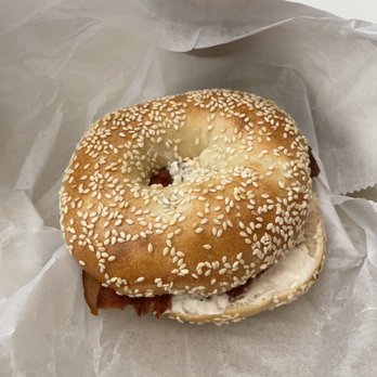 Bodo's Bagels - Sesame bagel with honey and nut spread with bacon - Bagels Near Me - Charlottesville, Virginia