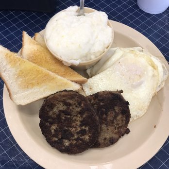 Canecutters Smokehouse & Grill - 3 eggs over medium with 2 sausage patties, grits, and toast. - Smokehouse Near Me - Demopolis, Alabama