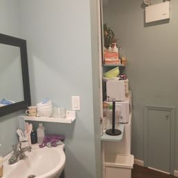 By the bathroom area.