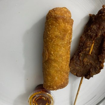 New China Restaurant - two fried food items on a white plate - Chinese Near Me - Carpentersville, Illinois New China Restaurant - two fried food items on a white plate - Chinese Near Me - Carpentersville, Illinois