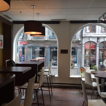 Van Houtte - a view of a restaurant with tables and chairs - Coffee & Tea Near Me - Montreal, Quebec