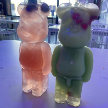 Popfancy Dessert Bar - Nutcracker's Gift drink (left) & Grinch's Heart drink (right). Both drinks costed $6.45 + $2.50 for the Gummy Bear Bottles - Desserts Near Me - Houston, Texas Popfancy Dessert Bar - Nutcracker's Gift drink (left) & Grinch's Heart drink (right). Both drinks costed $6.45 + $2.50 for the Gummy Bear Bottles - Desserts Near Me - Houston, Texas