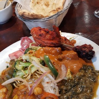 Yeti Restaurant - Buffet plate with rice center bottom surrounded by various items from buffet. Garlic naan in back. - Indian Near Me - Santa Rosa, California Yeti Restaurant - Buffet plate with rice center bottom surrounded by various items from buffet. Garlic naan in back. - Indian Near Me - Santa Rosa, California