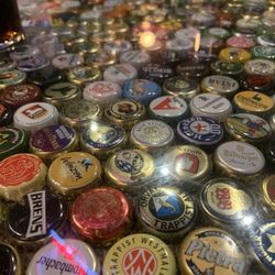 De Hems Dutch Cafe Bar - Glass top table with bottle caps!