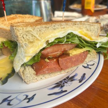 The Coffee Shack - Fried egg sandwich with Portuguese sausage and added avocado on onion dill bread - Coffee & Tea Near Me - Captain Cook, Hawaii The Coffee Shack - Fried egg sandwich with Portuguese sausage and added avocado on onion dill bread - Coffee & Tea Near Me - Captain Cook, Hawaii