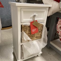 Cute white wooden drawer with wicker baskets  as drawers