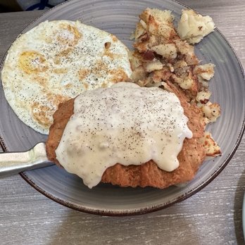 Country Griddle - Country fried chicken w 3 over medium eggs w country potatoes - American Near Me - Goodyear, Arizona