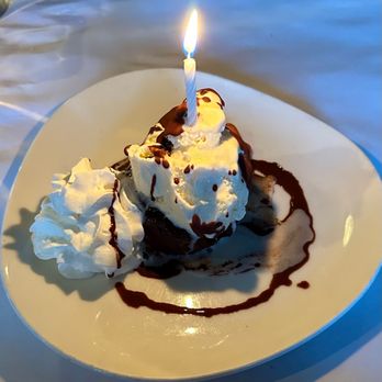 Black Cat Bistro - Chocolate lava cake with vanilla ice cream and whipped cream. Celebrating a birthday :) - New American Near Me - Cambria, California Black Cat Bistro - Chocolate lava cake with vanilla ice cream and whipped cream. Celebrating a birthday :) - New American Near Me - Cambria, California