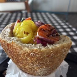 Under the veggies is mortadella and cheese with olive oil and balsamic vinegar! Delicious!