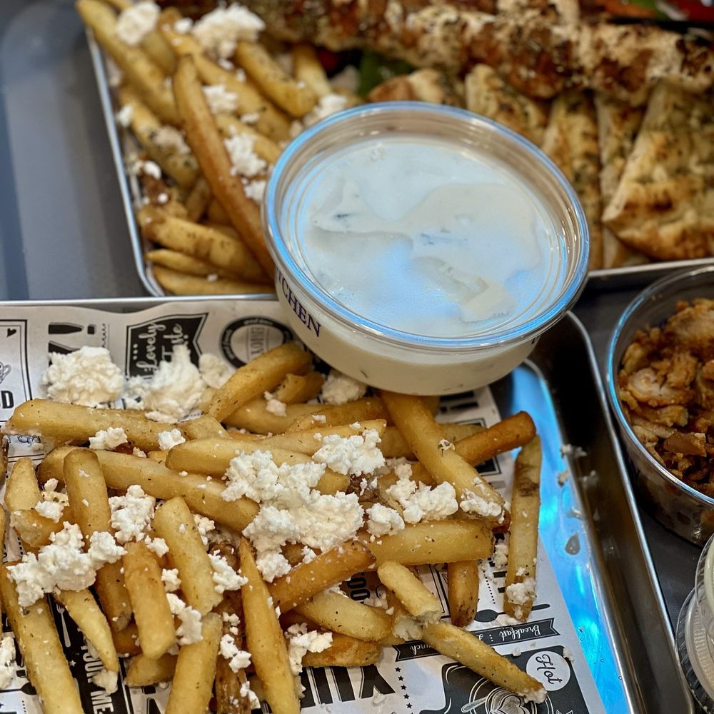 Greek  Fries with feta. Chicken Souvlaki Platter and side of Sliced gyro.