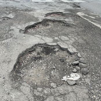 Redcoat Tavern - The unofficial Michigan slogan: fix the damn roads! Or in this case parking lot. - Bars Near Me - Royal Oak, Michigan