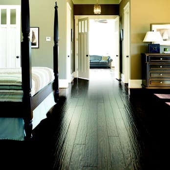 Yates Flooring Center - a bedroom with four poster bed - Flooring Near Me - Midland, Texas Yates Flooring Center - a bedroom with four poster bed - Flooring Near Me - Midland, Texas