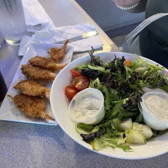 Fishbones Raw Bar And Restaurant - Coconut shrimp and garden salad - Seafood Near Me - Duck, North Carolina Fishbones Raw Bar And Restaurant - Coconut shrimp and garden salad - Seafood Near Me - Duck, North Carolina