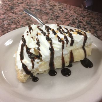 Blue Bonnet Cafe - Peanut butter pie with chocolate drizzle. - Desserts Near Me - Marble Falls, Texas