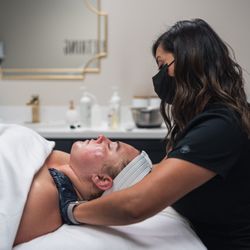 Kalon Skin Studio - Neck and shoulder massage during a facial