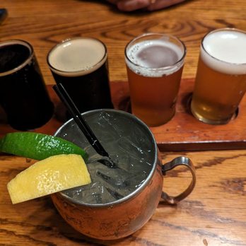 Dublin Bay Irish Pub & Grill - Beer flight and peach mule - American Near Me - Ames, Iowa
