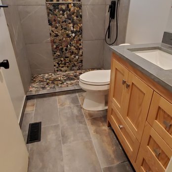 INI Construction - a bathroom with a stone shower - General Contractors Near Me - Santa Rosa, California INI Construction - a bathroom with a stone shower - General Contractors Near Me - Santa Rosa, California