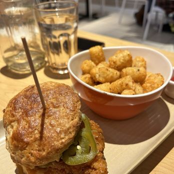Chewie's Chicken & Biscuits - a plate of fried tater tots and a bowl of tater tots - Sandwiches Near Me - Vancouver, British Columbia