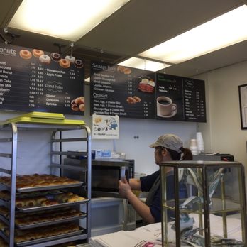 Parks Donuts - a woman working behind the counter - Donuts Near Me - Richardson, Texas Parks Donuts - a woman working behind the counter - Donuts Near Me - Richardson, Texas