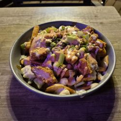 St. Louis Bar & Grill - A steaming hot bowl of St. Louis Wings Poutine. A longtime favourite dish of mine from 1/2 Price appetizer Thursdays.