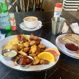 Farmhouse breakfast, toast, cappuccino, and many beverages.