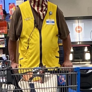 Walmart Supercenter - Satire at its best in the sign behind him - Department Stores Near Me - Tehachapi, California