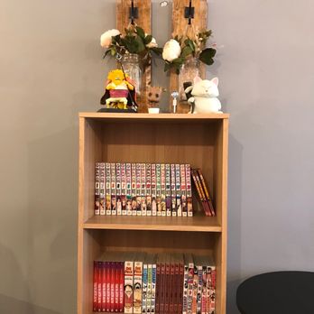 MewTea Cafe - a bookshelf with books on it - Bubble Tea Near Me - Garden Grove, California MewTea Cafe - a bookshelf with books on it - Bubble Tea Near Me - Garden Grove, California