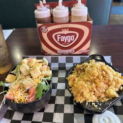 Jayell Smoke House - Side salad (left); Shepherd's Pie with brisket (right); a case of different BBQ sauces in the background