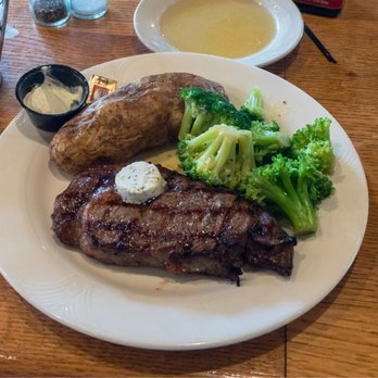 Stoneforge Grill - Kansas City strip (with garlic butter) with overdone baked potato. Steak was excellent - American Near Me - South Easton, Massachusetts