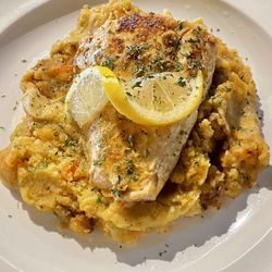 Mamie G's - Grilled Salmon over Seafood Dressing