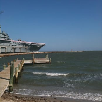 Pier 99 - View of USS Lexington from Pier 99 patio - Seafood Near Me - Corpus Christi, Texas Pier 99 - View of USS Lexington from Pier 99 patio - Seafood Near Me - Corpus Christi, Texas