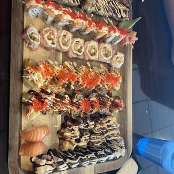 Three Samurai Japanese Restaurant - Sushi Boat (don't know the order of what they were... only one i know for sure is the one in line with the salmon nigiri is the Bagel roll) - Japanese Near Me - Coralville, Iowa Three Samurai Japanese Restaurant - Sushi Boat (don't know the order of what they were... only one i know for sure is the one in line with the salmon nigiri is the Bagel roll) - Japanese Near Me - Coralville, Iowa