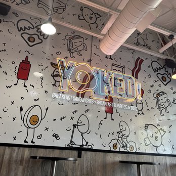 Yolked - a wall with a variety of drawings on it - Breakfast & Brunch Near Me - Bakersfield, California Yolked - a wall with a variety of drawings on it - Breakfast & Brunch Near Me - Bakersfield, California