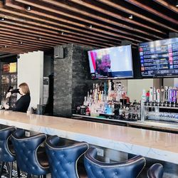 drafthouse - TVs bar service and comfy/retro barstools.