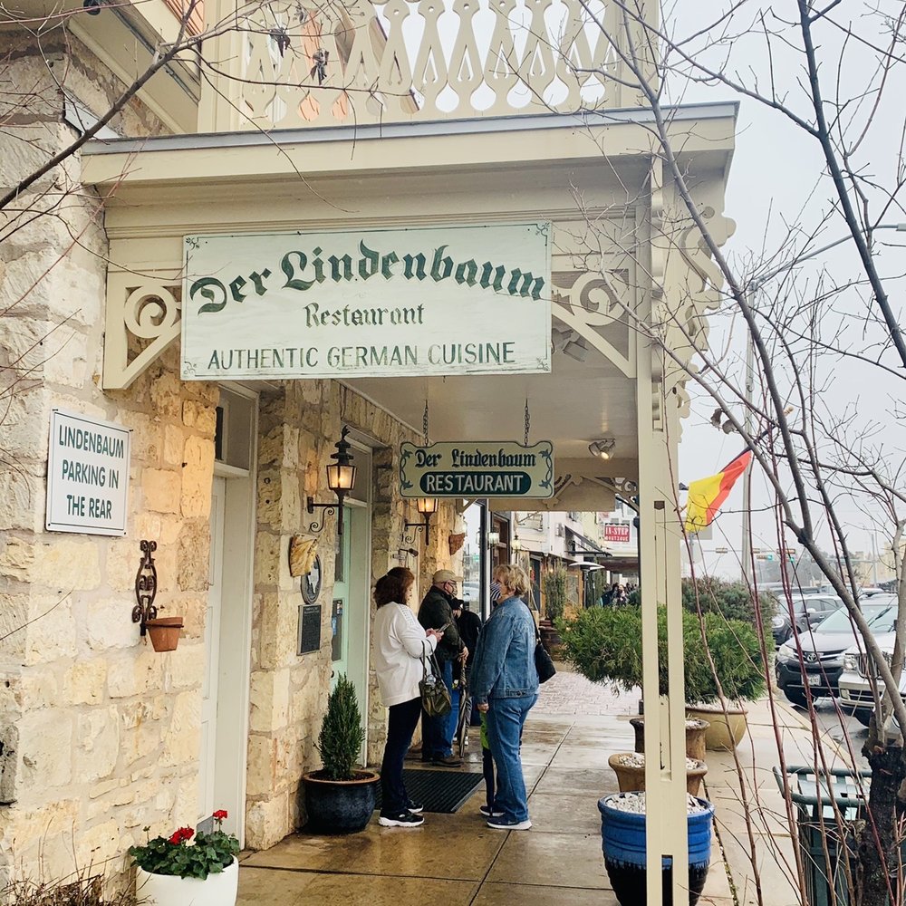 Der Lindenbaum - people standing outside of a restaurant - German Near Me - Fredericksburg, Texas
