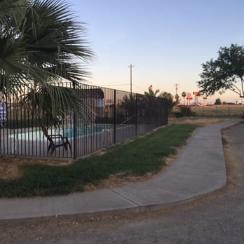 Happy Time Rv Park Reservations - Pool with truck stop in background. - RV Parks Near Me - Dunnigan, California Happy Time Rv Park Reservations - Pool with truck stop in background. - RV Parks Near Me - Dunnigan, California