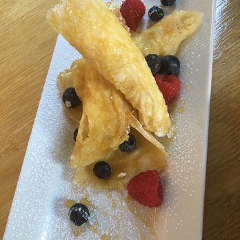 Roots Cafe - Breakfast dish - tastes like light crepes with great flavor. Dish is off the brunch menu, and it was a pizzetta or something similar. - Cafes Near Me - Charlotte, North Carolina