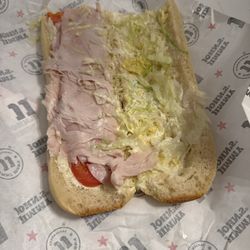 Jimmy John's - This is #4 2 slices of turkey, tiny slices of tomatoes, can you even see the lettuce? forgot to add cheese. This is what $40.30 gets you