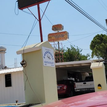 Ponderosa - a red car parked in front of a restaurant - Mexican Near Me - Snyder, Texas