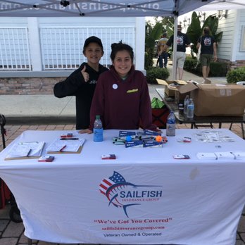 Sailfish Insurance Group - Two volunteers from Hidden Oaks Middle School's NJHS helping out at our booth. - Auto Insurance Near Me - Palm City, Florida Sailfish Insurance Group - Two volunteers from Hidden Oaks Middle School's NJHS helping out at our booth. - Auto Insurance Near Me - Palm City, Florida
