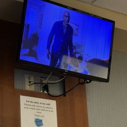 Atrium Medical Center - Wall-mounted television in each room