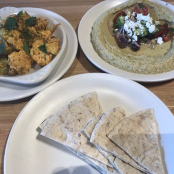 True Food Kitchen - Charred Cauliflower upper left and the great hummus dish with pita bread. Will give extra pita if asked. Delicious!! - Vegetarian Near Me - Naples, Florida True Food Kitchen - Charred Cauliflower upper left and the great hummus dish with pita bread. Will give extra pita if asked. Delicious!! - Vegetarian Near Me - Naples, Florida
