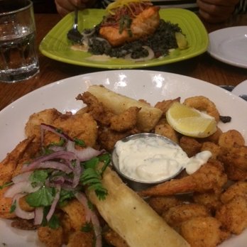 Puerto 27 Peruvian Kitchen & Pisco Bar - Jalea Mixta; lightly coated, fried calamari (tender), shrimp, scallops and halibut. Garnished with pineapple and huacatay tartar sauce. - Peruvian Near Me - Pacifica, California