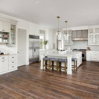 Star Hardwood Flooring - a kitchen with white cabinets and a center island - Flooring Near Me - Kaufman, Texas Star Hardwood Flooring - a kitchen with white cabinets and a center island - Flooring Near Me - Kaufman, Texas