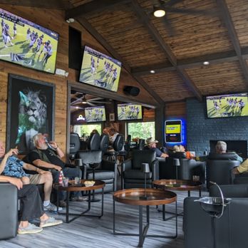 Churchill’s Lounge - a large group of people sitting in chairs and watching televisions - Lounges Near Me - Delavan, Wisconsin