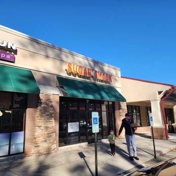 Sugar Shack Donuts - a man walking down the sidewalk - Donuts Near Me - Midlothian, Virginia