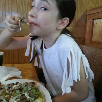 Nueva Villa - Delicious fajita nachos being devoured by a hungry little pirate! - Mexican Near Me - Hartsville, South Carolina