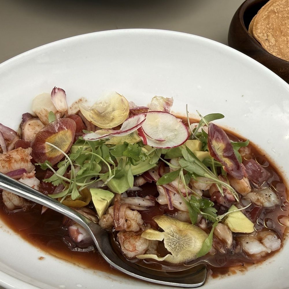 Toro Bravo - Ancho chili crusted NY steak w/ bone marrow butter and ceviche mixto with fish, shrimp, octopus - Steakhouses Near Me - Reno, Nevada